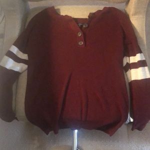 Red with white stripped sleeves and buttons sweater